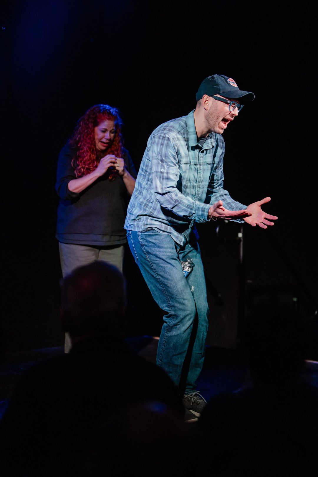 Erik mid-reenactment while a castmate cracks up